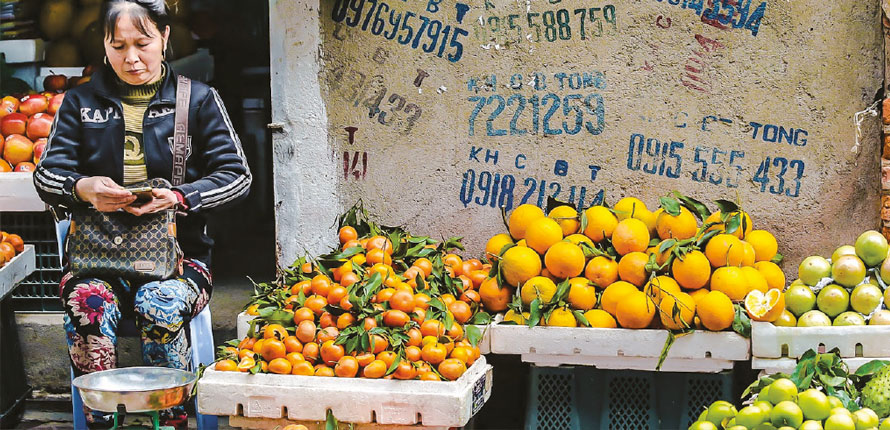 woman manages food stand
